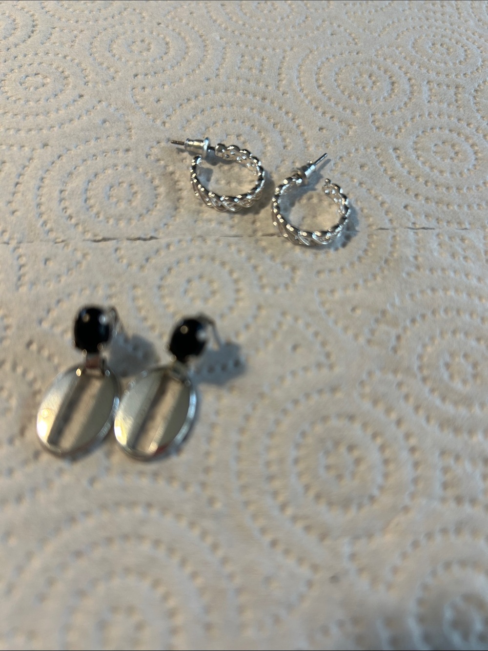 2 silver tone earrings set one hoops and one dangle worn black accents